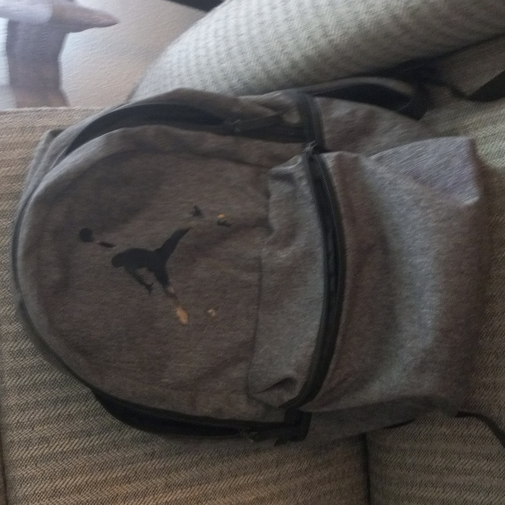 Gray Backpack with air stickers and soaring basketball player